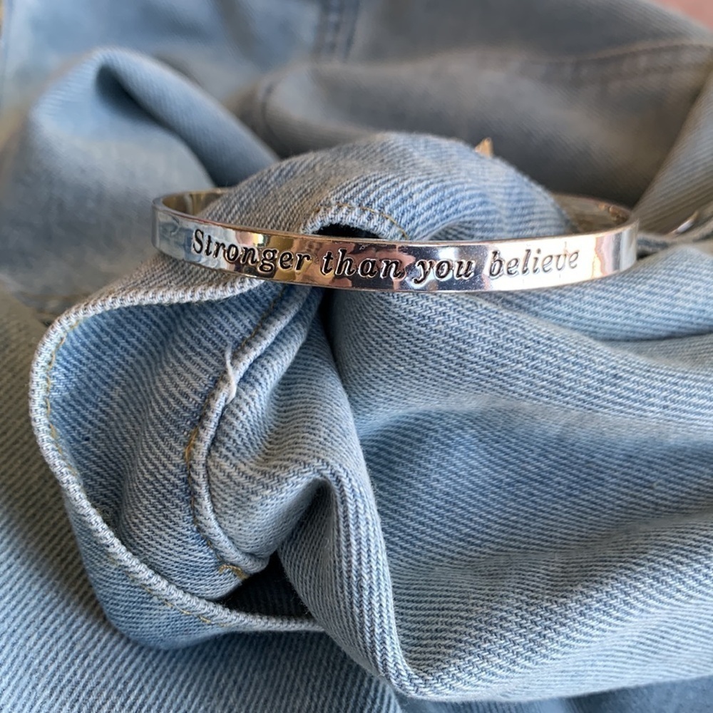 Silver bracelet with motivational phrase Stronger than you believe